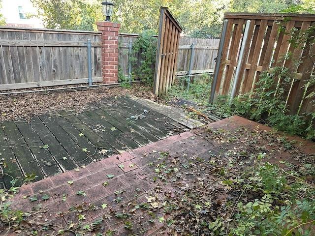 3133 Sappington Place, Unit C Fort Worth, TX 76116 - Photo 5 of 5 a view of a backyard with wooden fence