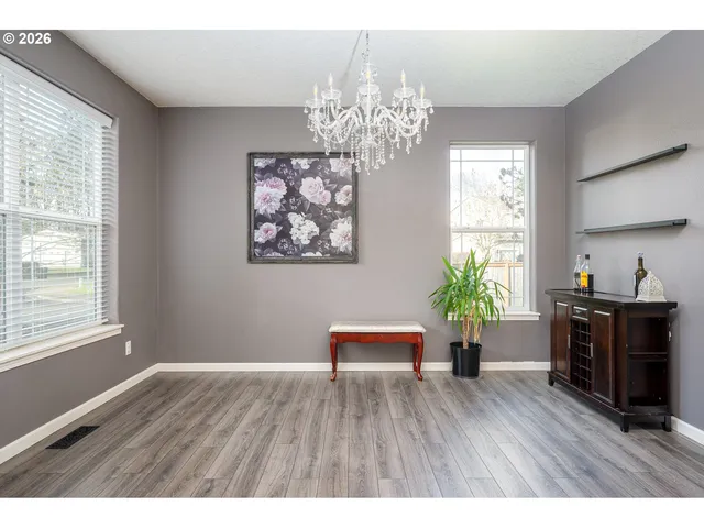 a workspace with furniture window and wooden floor