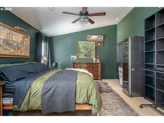 a bathroom with a granite countertop sink a mirror and a bathtub