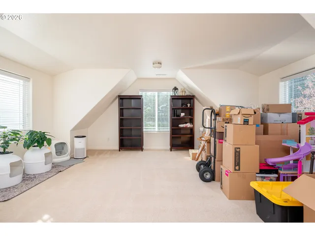 a view of a livingroom with furniture and windows