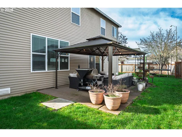 a house view with a backyard space
