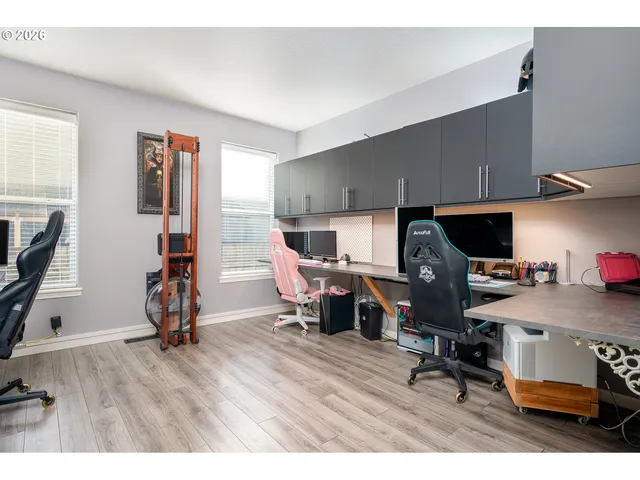 a workspace with furniture hardwood and a window