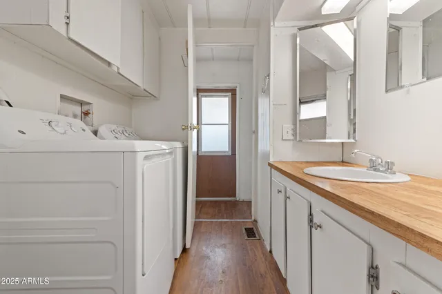 an empty room with a ceiling fan and window