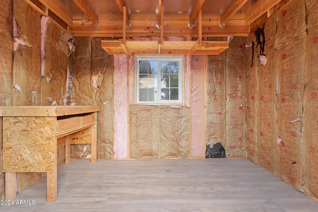 a view of swimming pool with outdoor seating and a garden