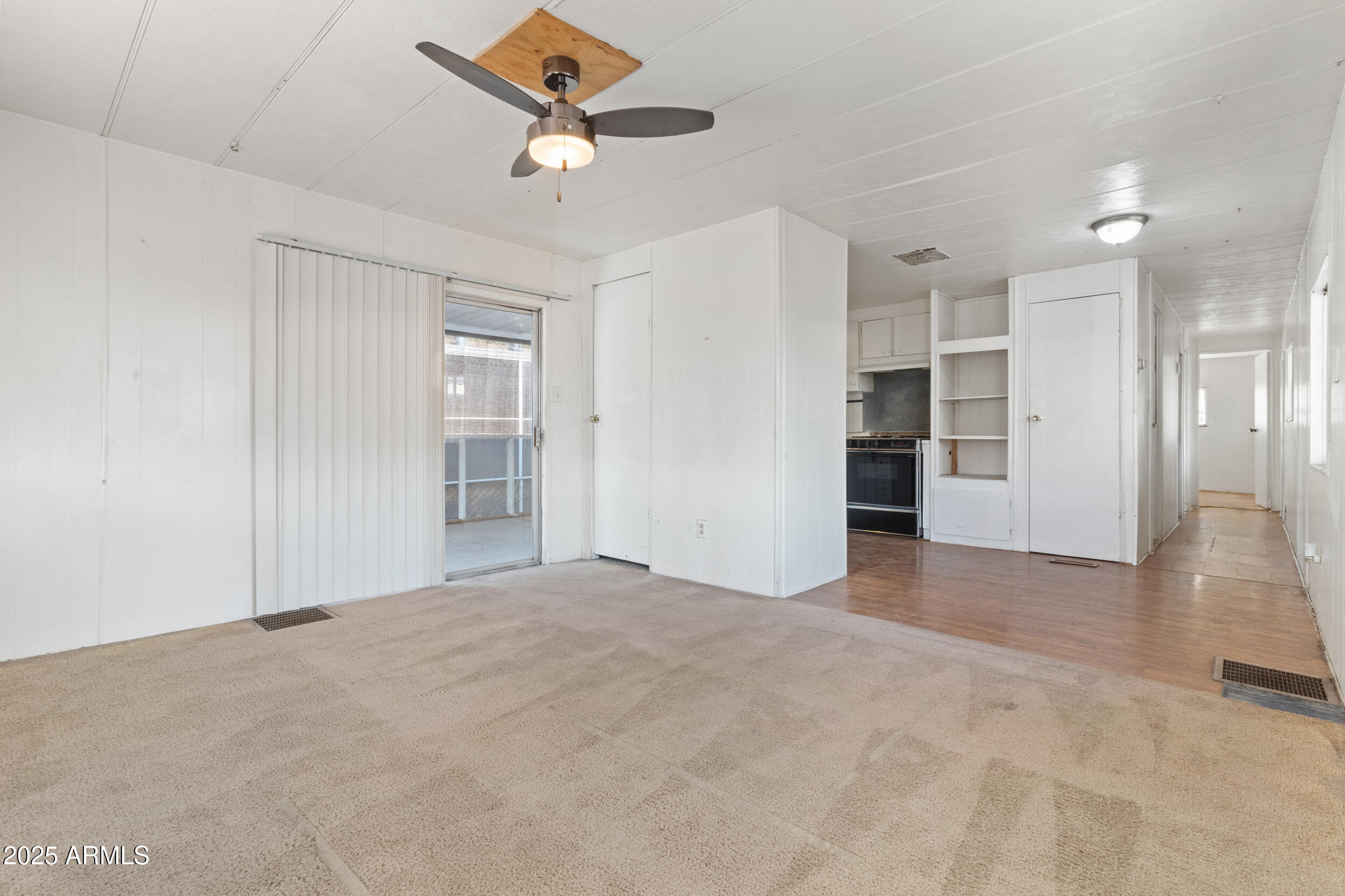 535 South Alma School Road, Unit 12 Mesa, AZ 85210 - Photo 3 of 66 a view of a livingroom with a ceiling fan