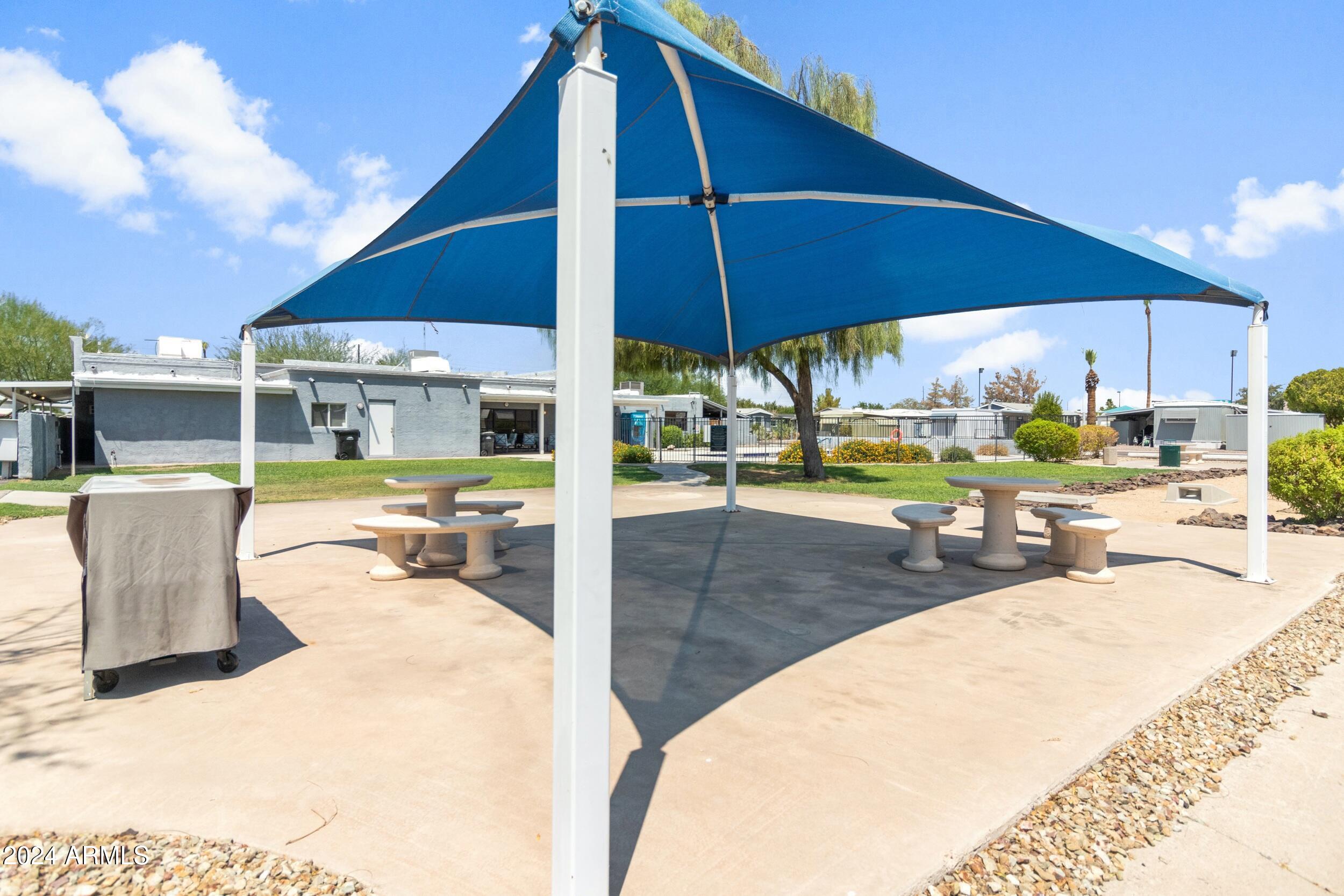 535 South Alma School Road, Unit 12 Mesa, AZ 85210 - Photo 35 of 66 a view of a swimming pool with a patio