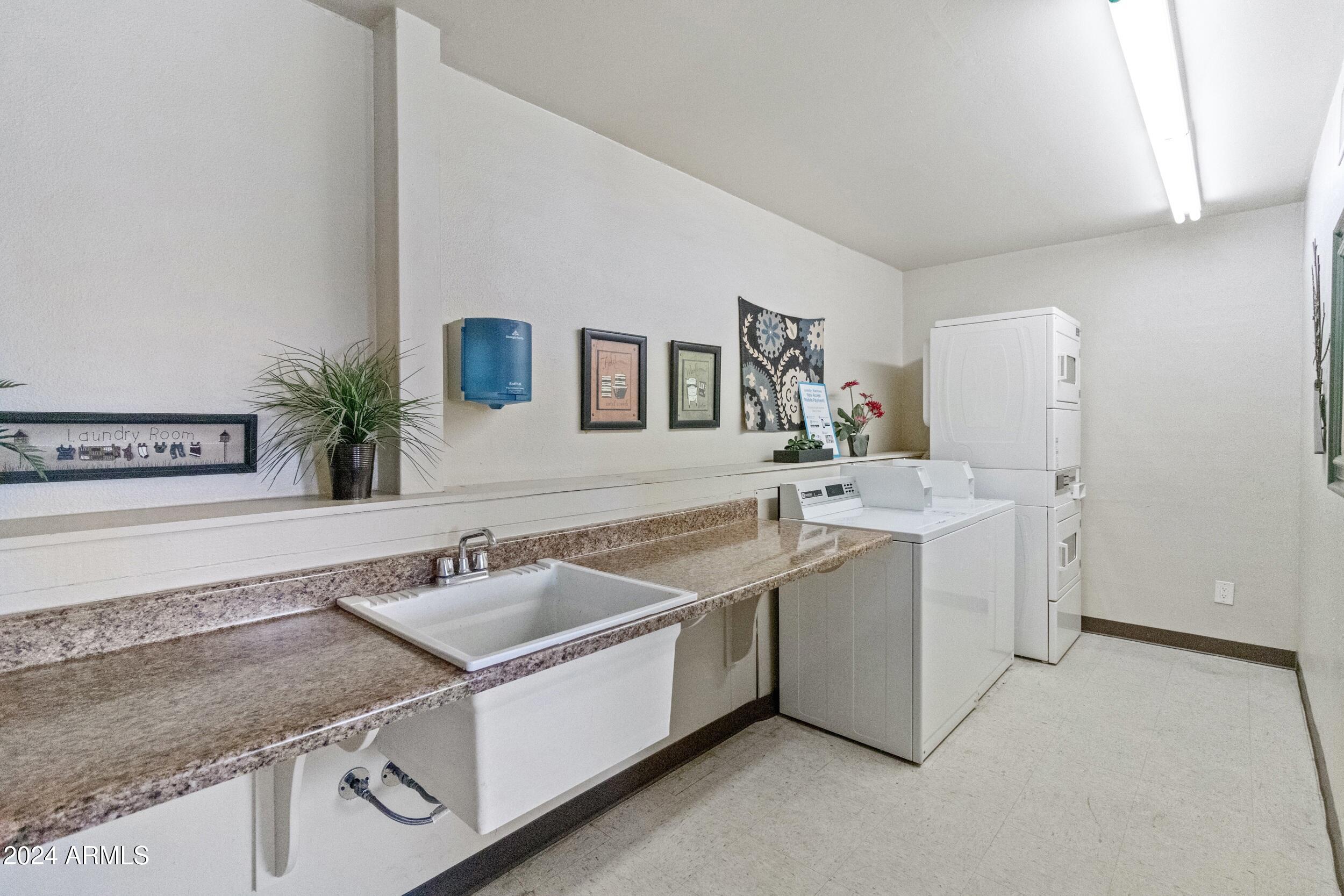 535 South Alma School Road, Unit 12 Mesa, AZ 85210 - Photo 37 of 66 a utility room with a sink a washer and dryer