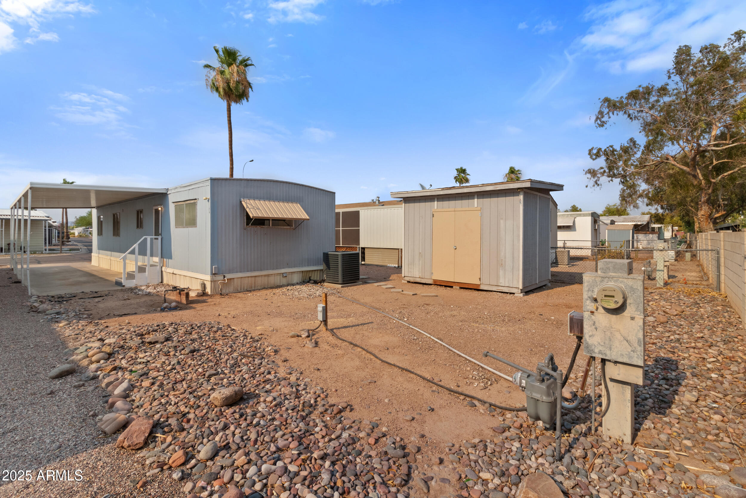 535 South Alma School Road, Unit 12 Mesa, AZ 85210 - Photo 64 of 66 a backyard of a house with table and chairs