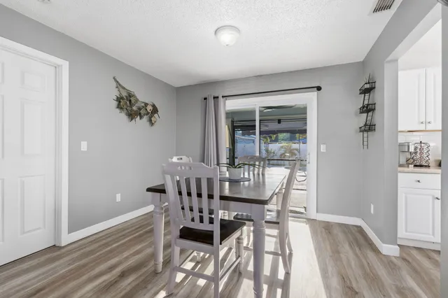 a kitchen with a sink cabinets and window