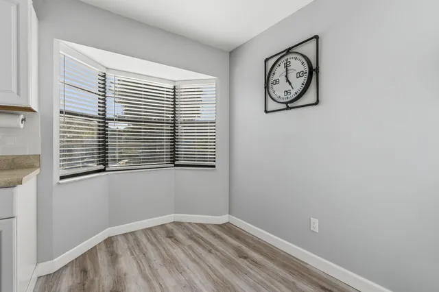 a bathroom with a toilet and a shower curtain
