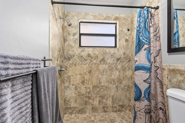 a front view of a house with glass windows