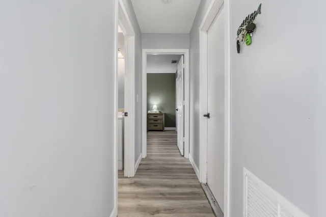 a kitchen with stainless steel appliances kitchen island granite countertop a refrigerator and a sink