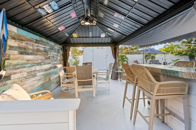 a view of a swimming pool with outdoor seating