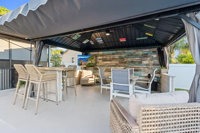 a view of a chairs and table in a patio