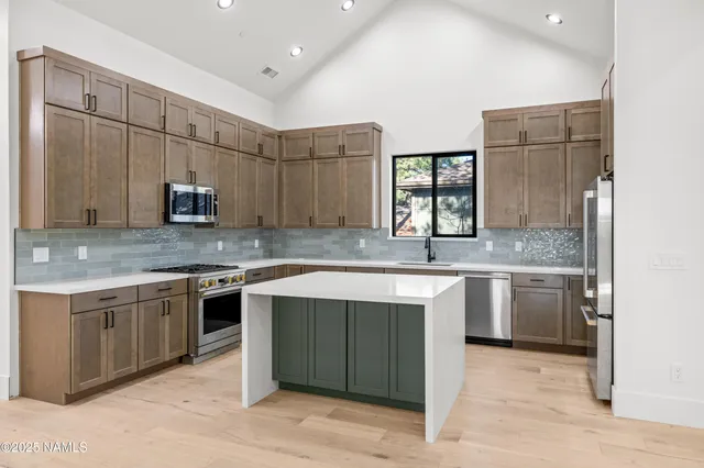 an empty room with a ceiling fan and window