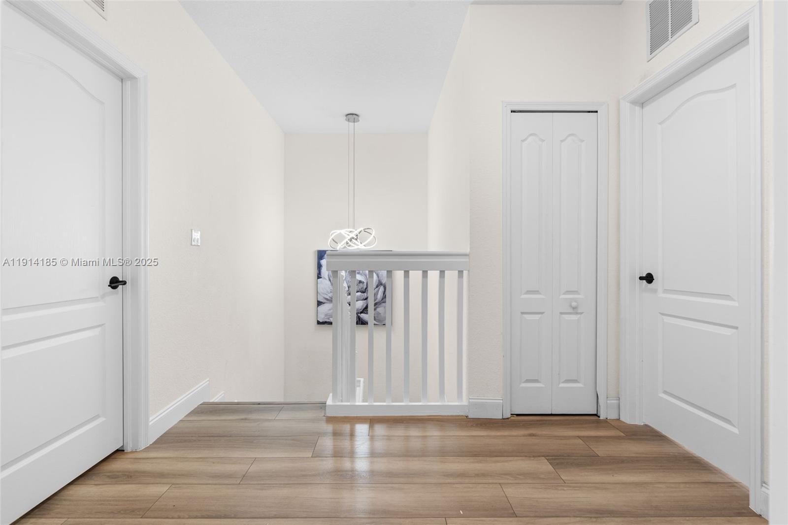 8181 Southwest 118th Court Miami, FL 33183 - Photo 15 of 33 a view of a door with wooden floor