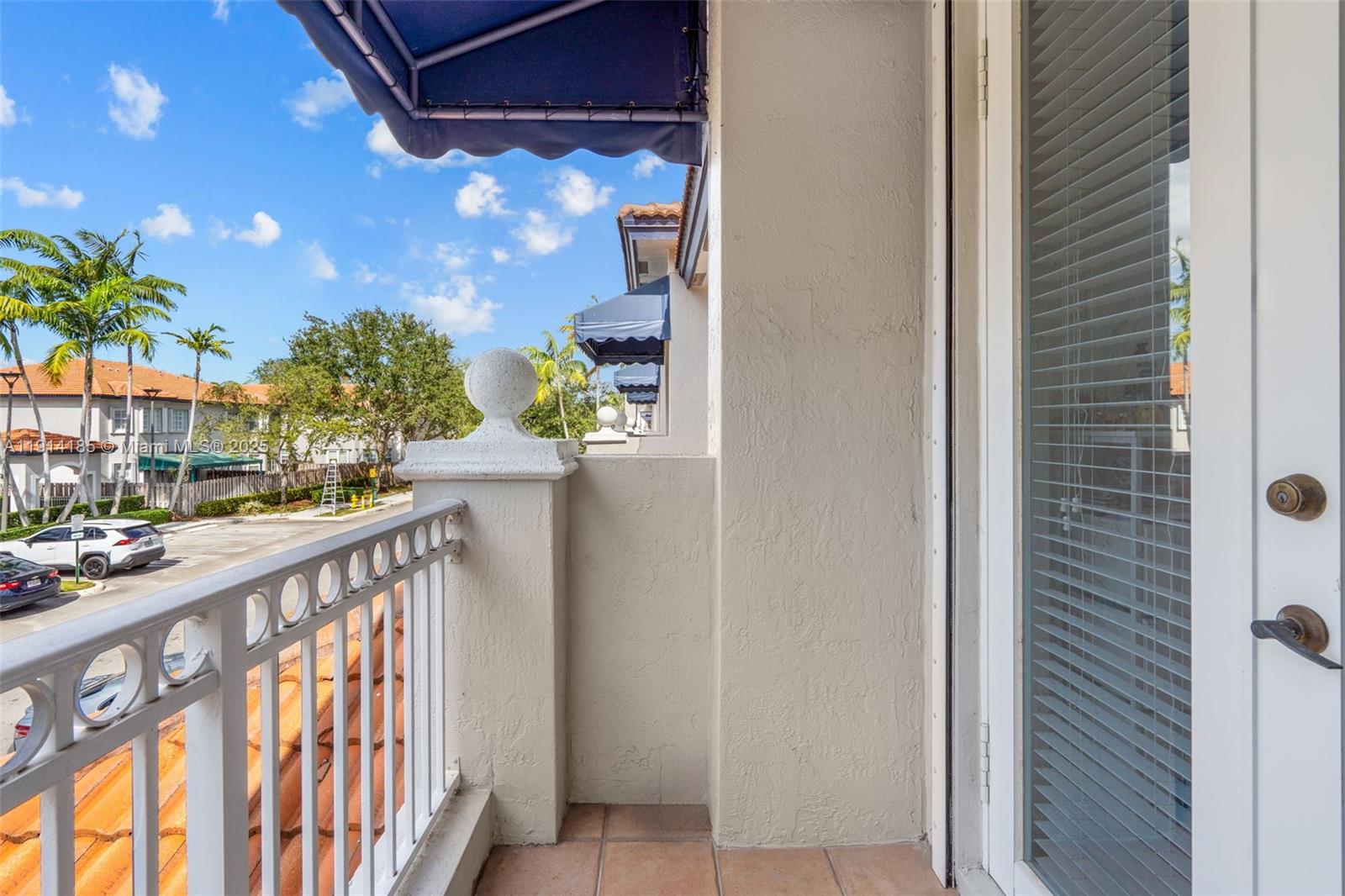 8181 Southwest 118th Court Miami, FL 33183 - Photo 18 of 33 a view of balcony with potted plants