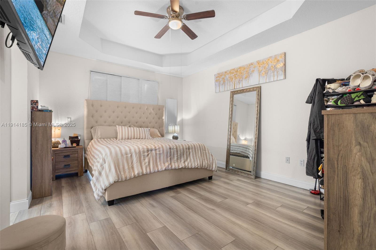 8181 Southwest 118th Court Miami, FL 33183 - Photo 22 of 33 a bedroom with a bed and wooden floor