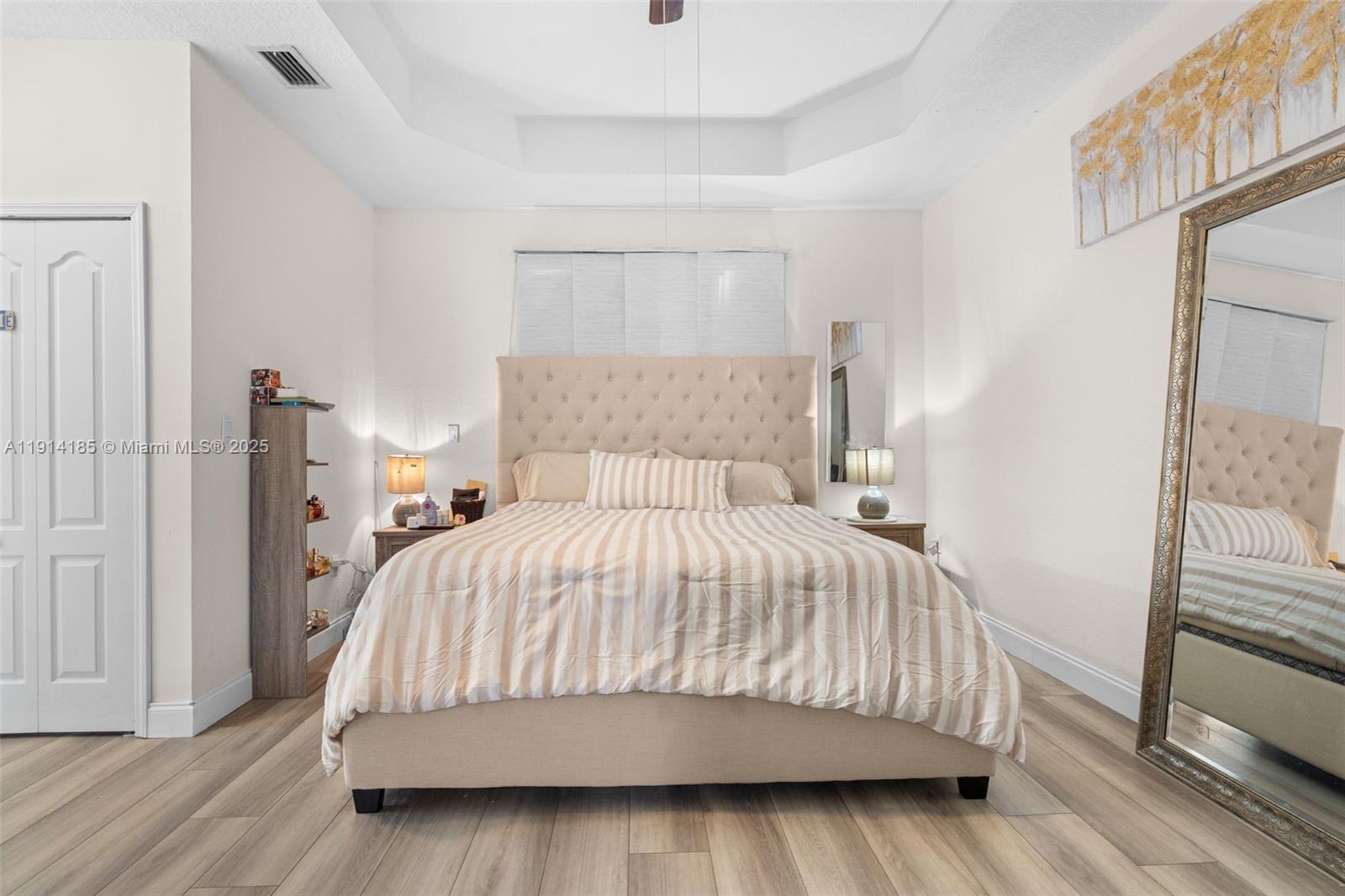 8181 Southwest 118th Court Miami, FL 33183 - Photo 23 of 33 a bedroom with a bed and wooden floor