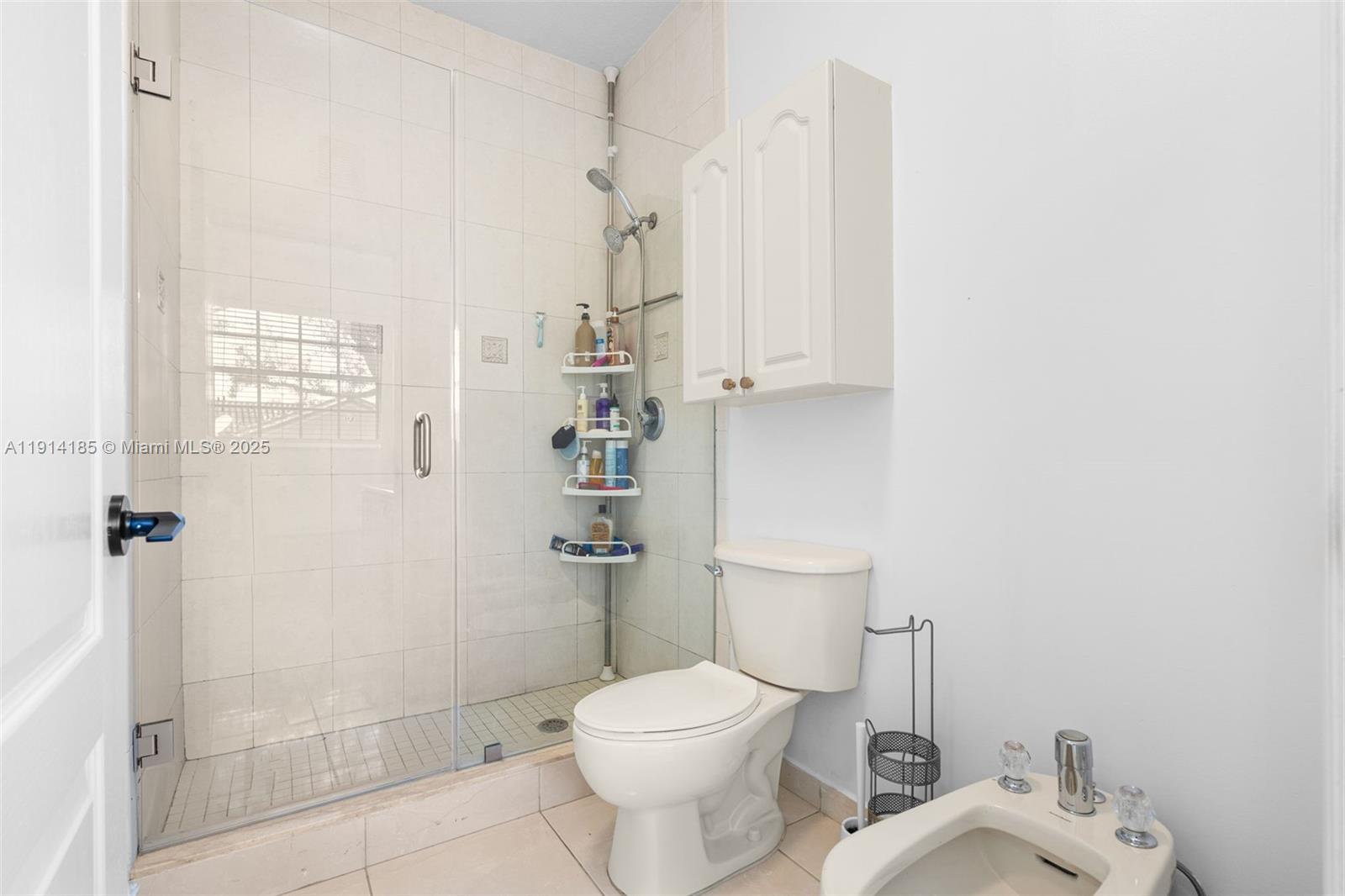 8181 Southwest 118th Court Miami, FL 33183 - Photo 25 of 33 a white toilet sitting next to a bathroom sink