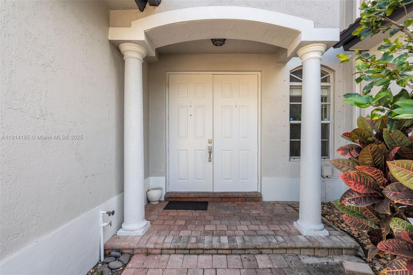 8181 Southwest 118th Court Miami, FL 33183 - Photo 3 of 33 a view of entryway with a potted plant