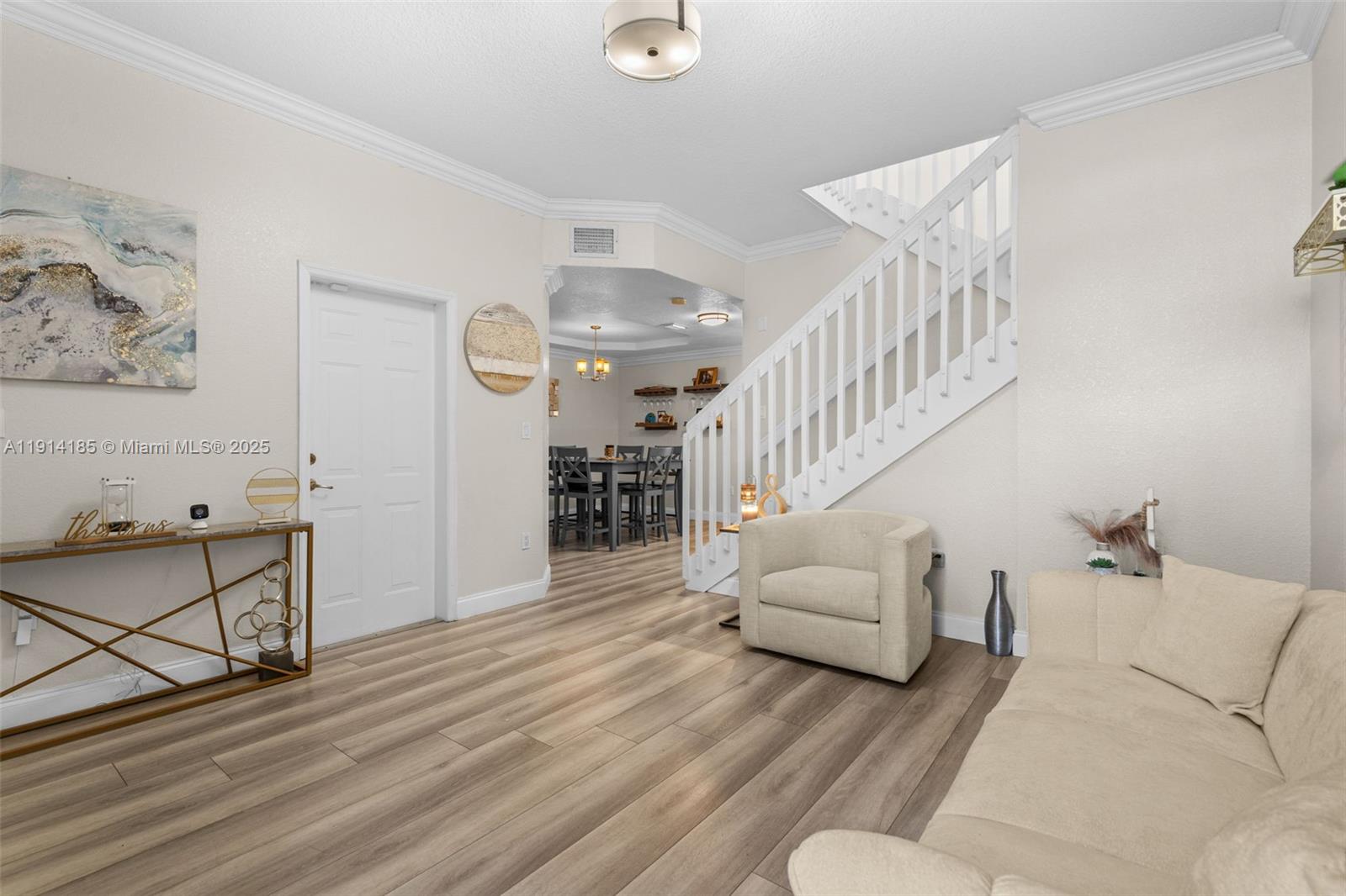 8181 Southwest 118th Court Miami, FL 33183 - Photo 5 of 33 a living room with furniture and wooden floor