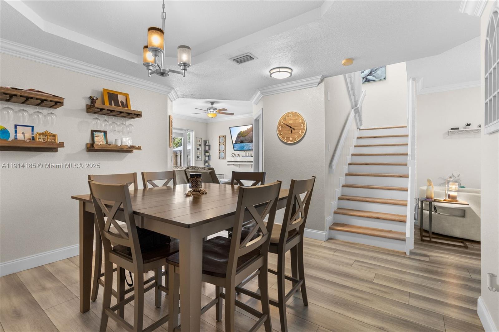 8181 Southwest 118th Court Miami, FL 33183 - Photo 7 of 33 a view of a dining room and kitchen with furniture and wooden floor