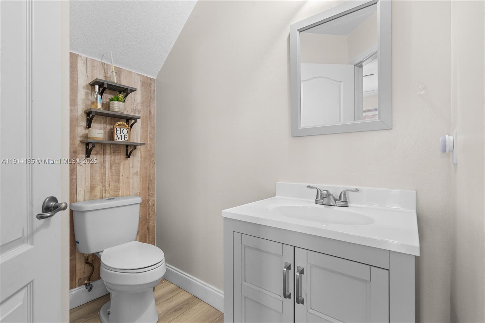 8181 Southwest 118th Court Miami, FL 33183 - Photo 8 of 33 a bathroom with a sink toilet and vanity