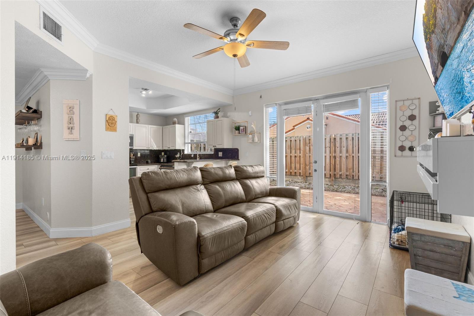 8181 Southwest 118th Court Miami, FL 33183 - Photo 9 of 33 a living room with furniture and a large window