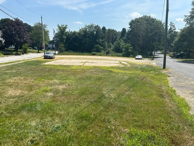 a view of outdoor space with trees all around
