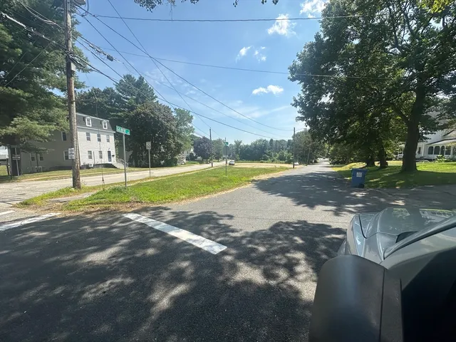 a view of a yard with basketball court