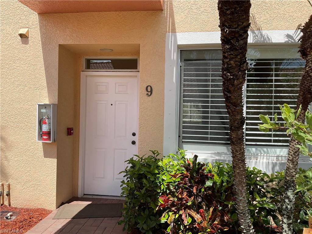 2380 Bayou Lane, Unit 7709 Naples, FL 34112 - Photo 8 of 15 Doorway to property with stucco siding