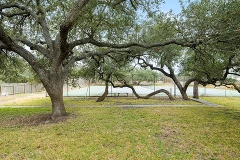 2003 North Fulton Beach Road, Unit 43 Rockport, TX 78382 - Photo 22 of 30 View from back deck showing oaks trees and tennis courts.