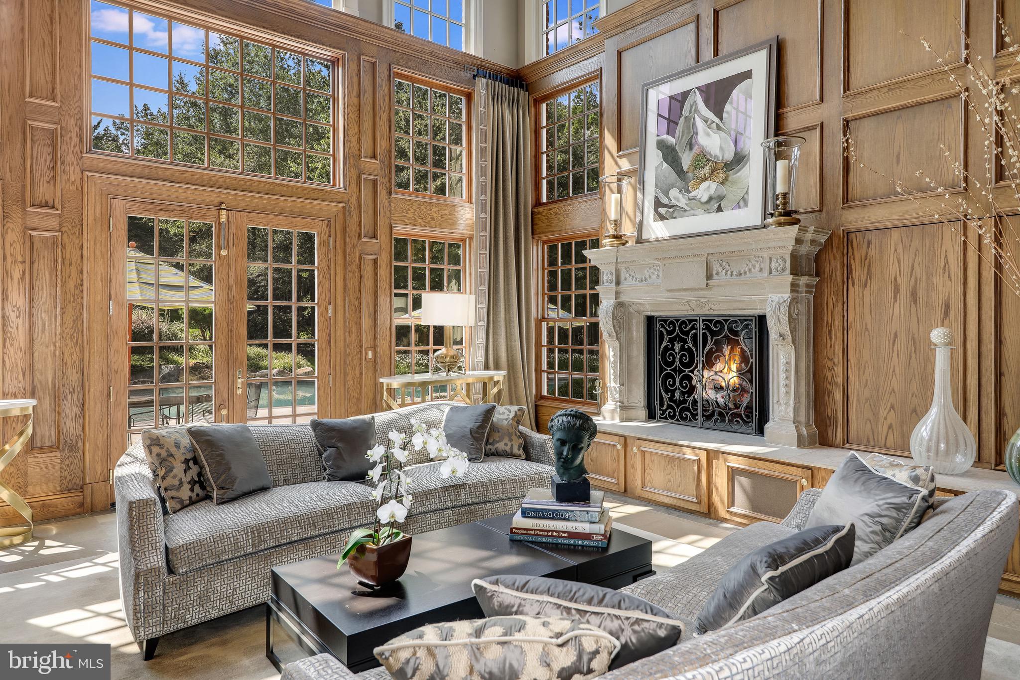 11720 Centurion Way Potomac, MD 20854 - Photo 13 of 81 a living room with furniture and a fireplace