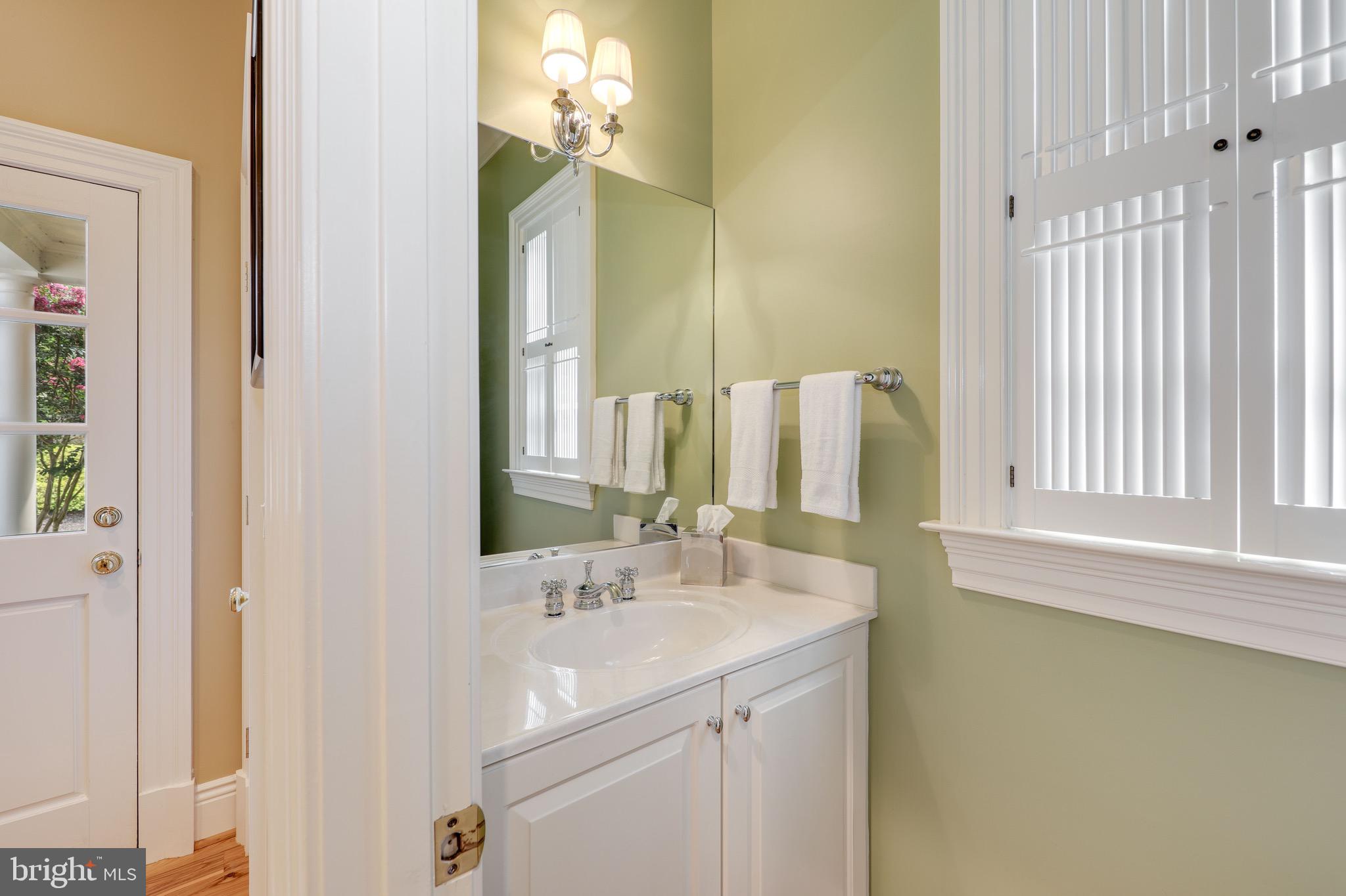 11720 Centurion Way Potomac, MD 20854 - Photo 30 of 81 a bathroom with a sink and a mirror