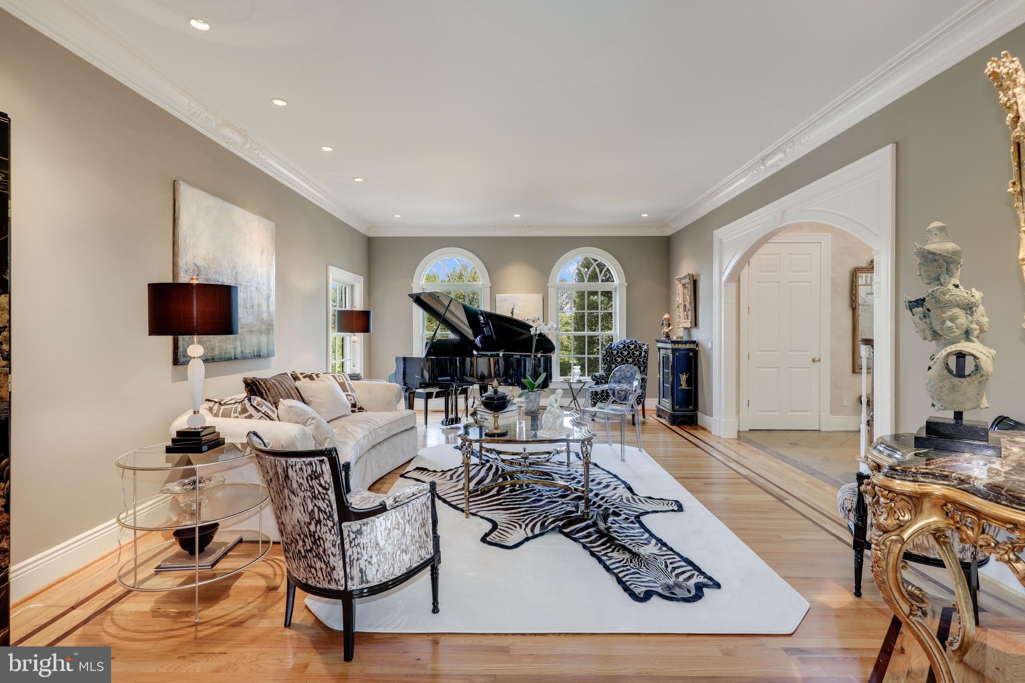 11720 Centurion Way Potomac, MD 20854 - Photo 5 of 81 a living room with furniture a rug and a flat screen tv