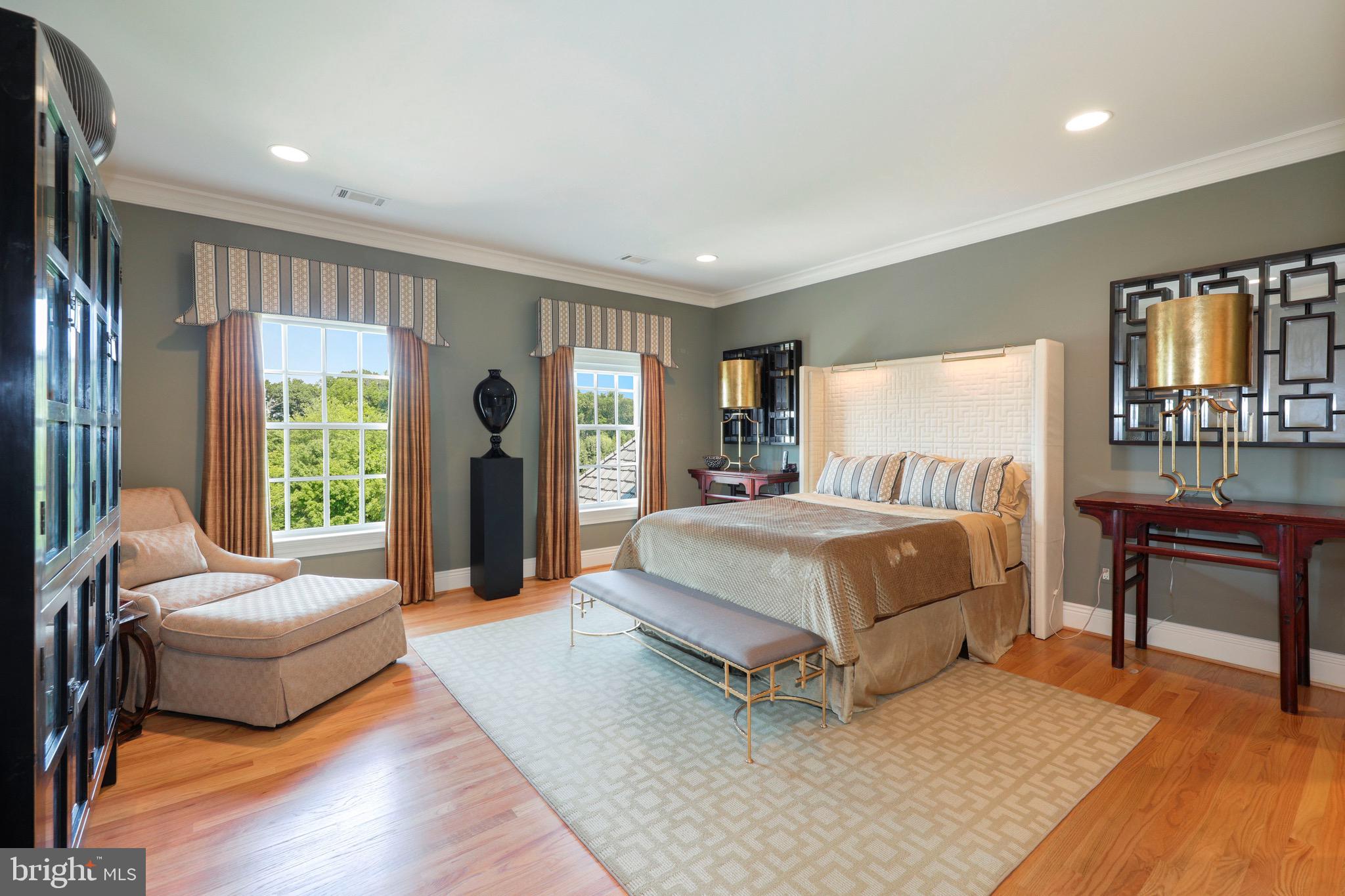 11720 Centurion Way Potomac, MD 20854 - Photo 42 of 81 a spacious bedroom with a bed and a couch