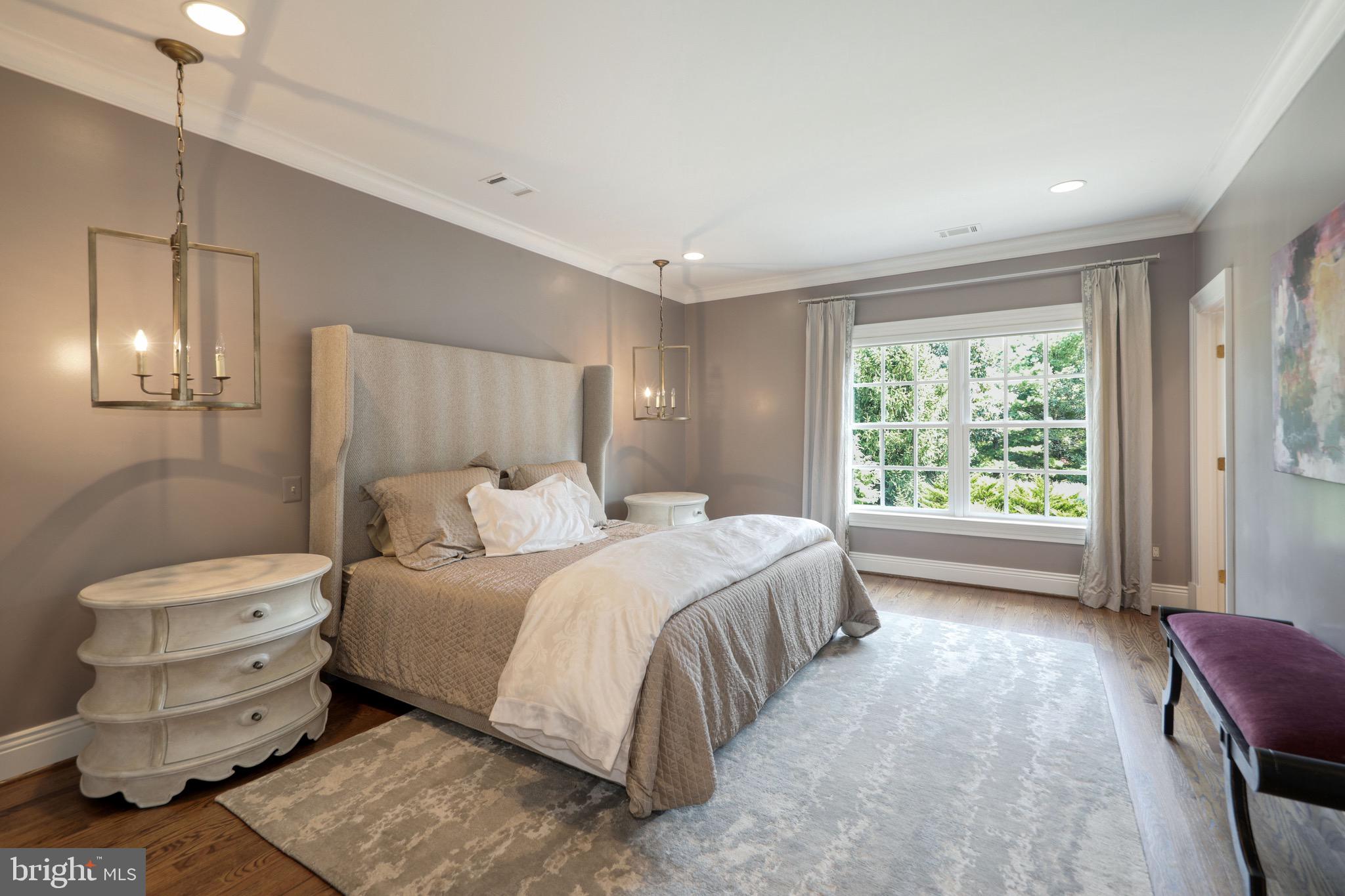 11720 Centurion Way Potomac, MD 20854 - Photo 47 of 81 a bedroom with a bed and large window