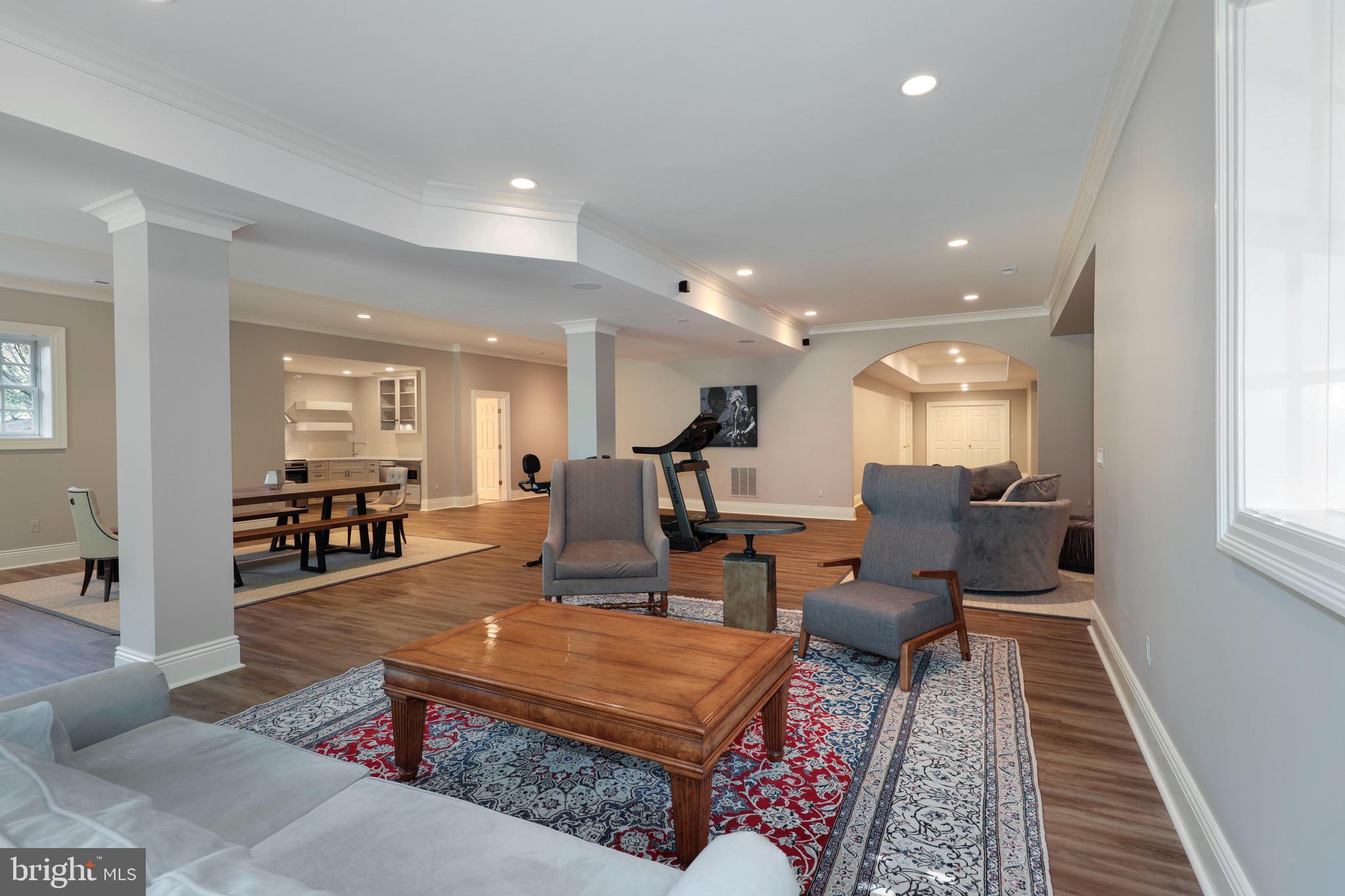 11720 Centurion Way Potomac, MD 20854 - Photo 51 of 81 a living room with furniture and a table