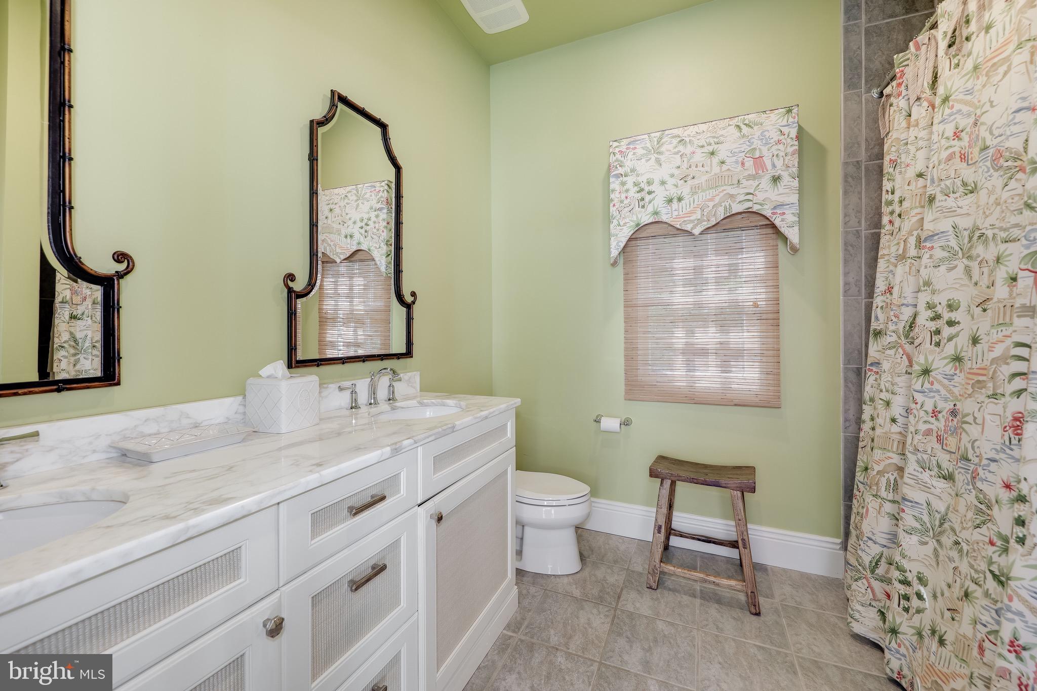 11720 Centurion Way Potomac, MD 20854 - Photo 65 of 81 a bathroom with a granite countertop toilet sink and mirror