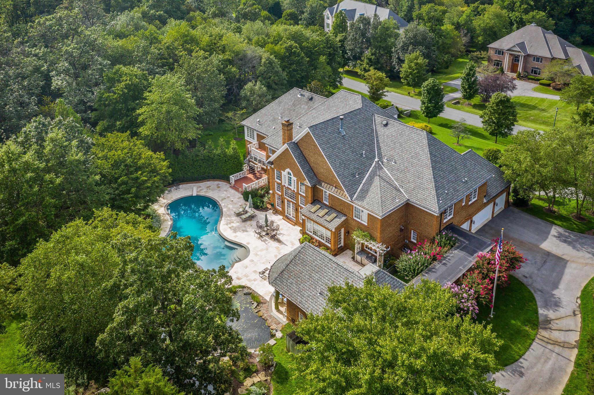 11720 Centurion Way Potomac, MD 20854 - Photo 73 of 81 an aerial view of a house with outdoor space and a garden