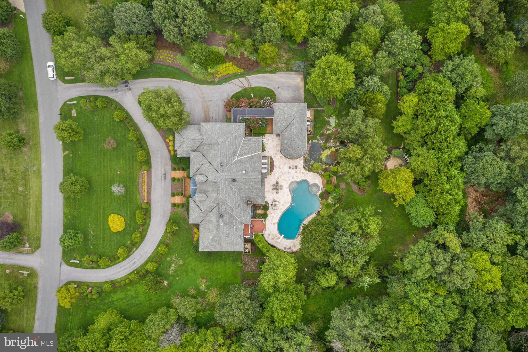 11720 Centurion Way Potomac, MD 20854 - Photo 75 of 81 an aerial view of a house with swimming pool and garden