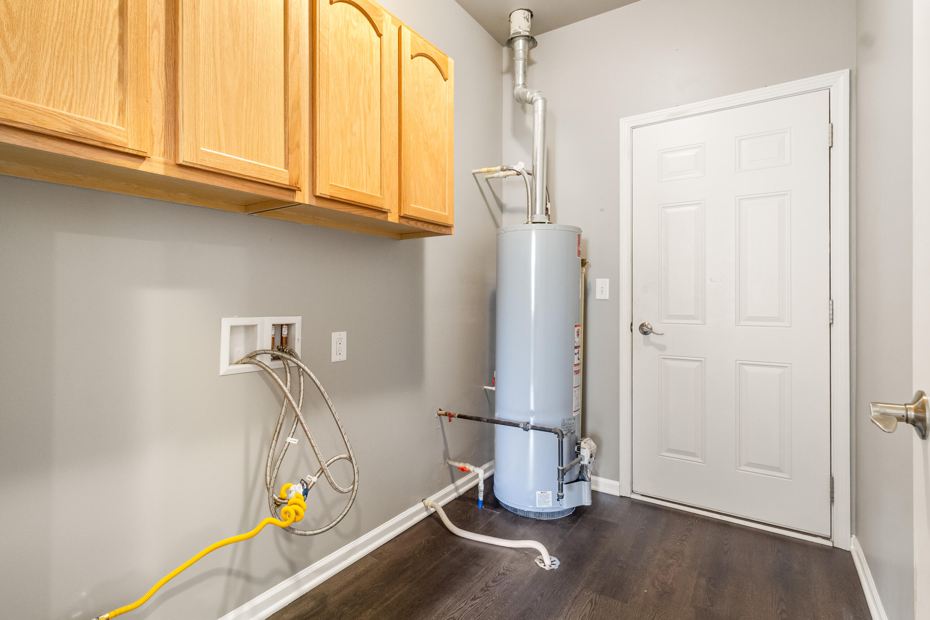 7615 111th Lane Crown Point, IN 46307 - Photo 11 of 19 a view of a room with wooden floor and cabinet