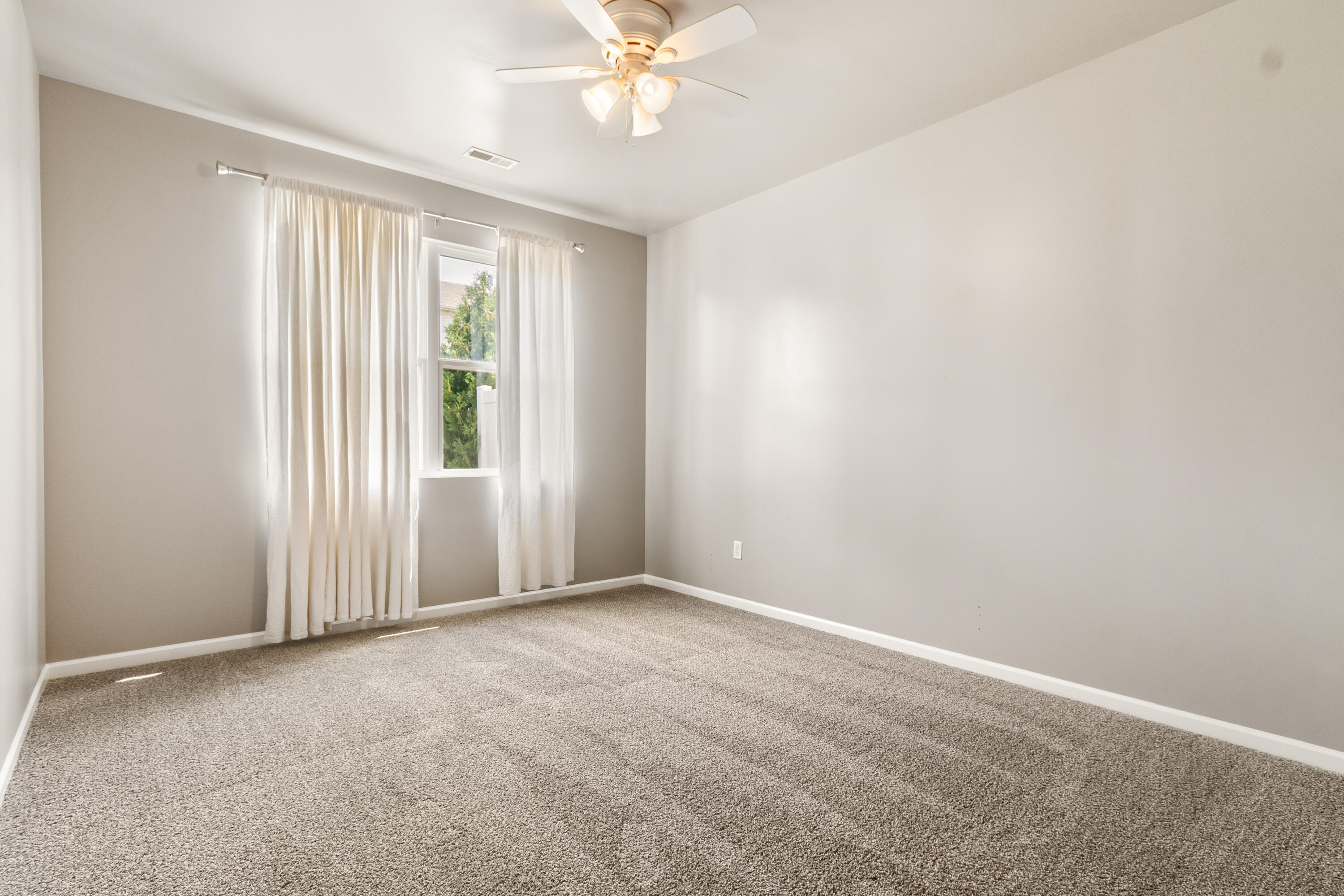 7615 111th Lane Crown Point, IN 46307 - Photo 14 of 19 an empty room with windows and fan