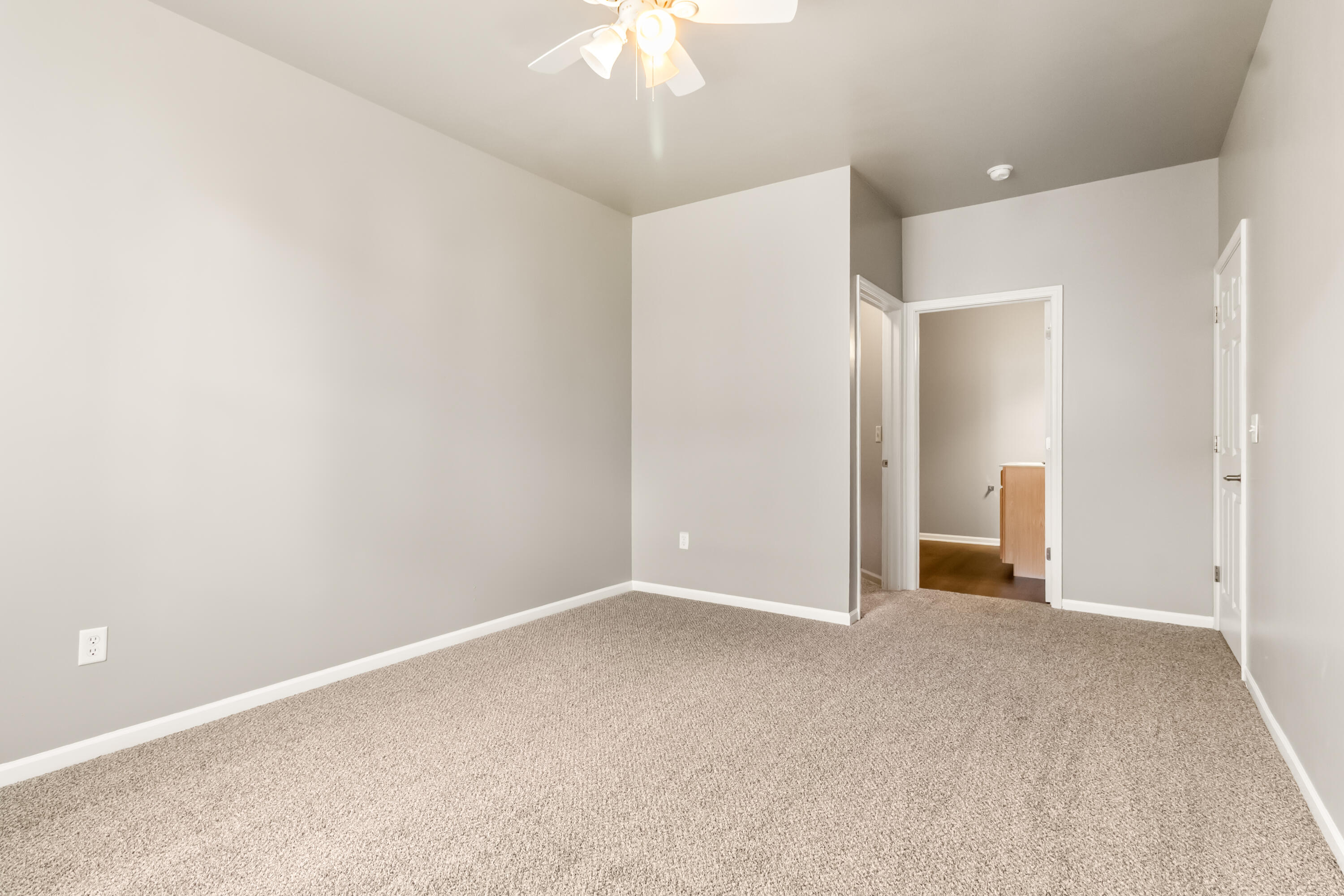 7615 111th Lane Crown Point, IN 46307 - Photo 15 of 19 a view of an empty room with a chandelier fan