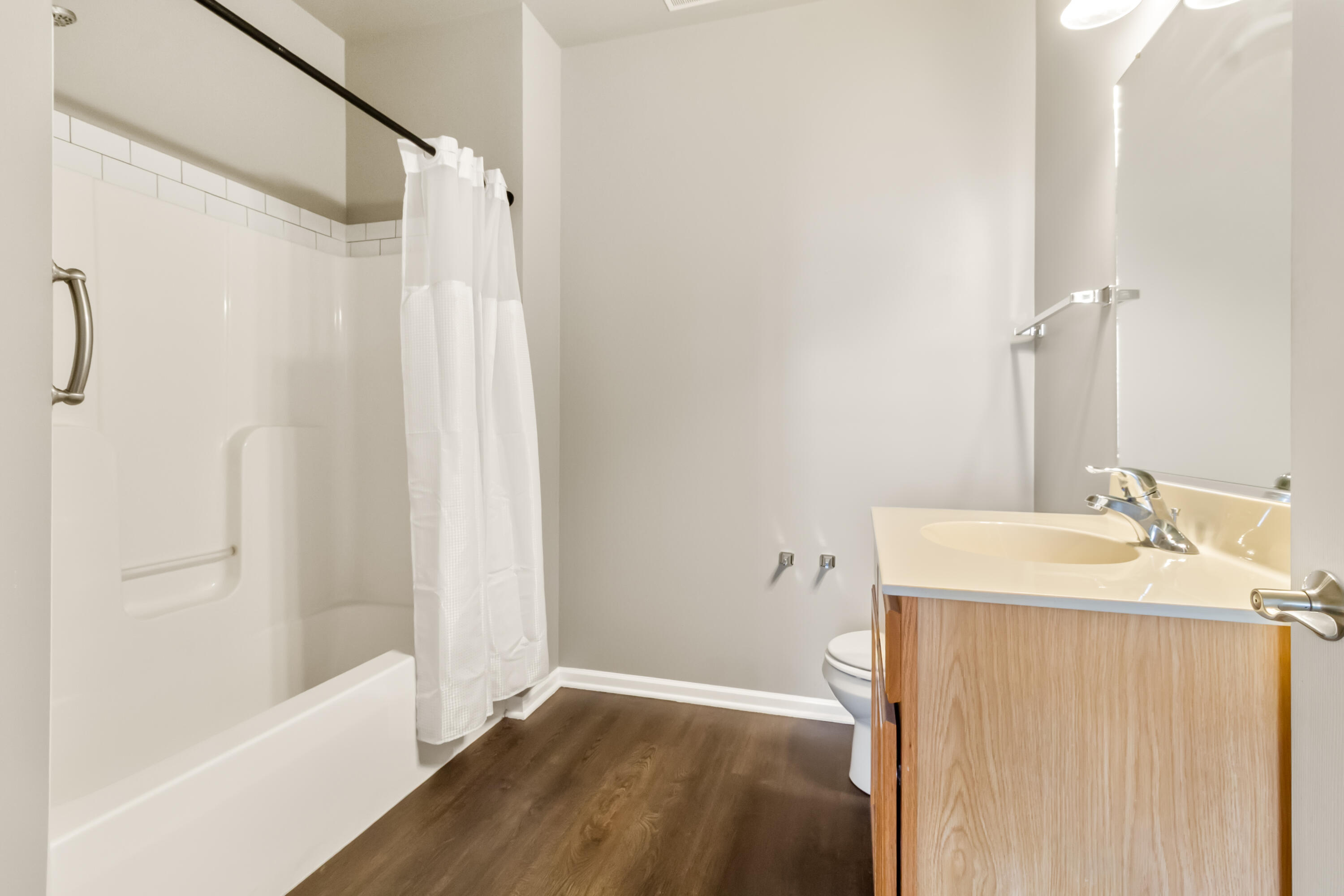 7615 111th Lane Crown Point, IN 46307 - Photo 17 of 19 a bathroom with a sink a toilet and shower