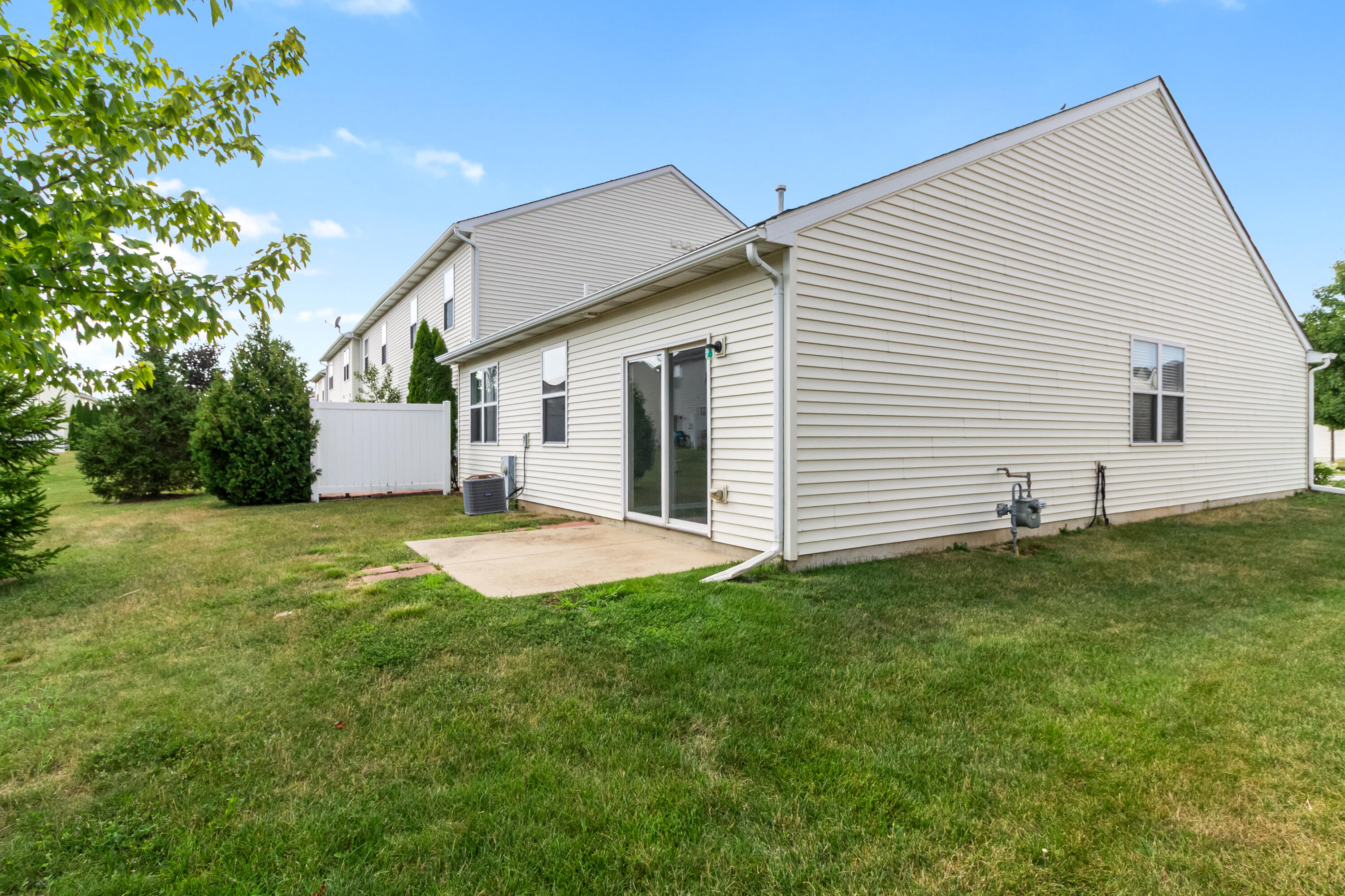 7615 111th Lane Crown Point, IN 46307 - Photo 19 of 19 a view of a house with a yard and a garage