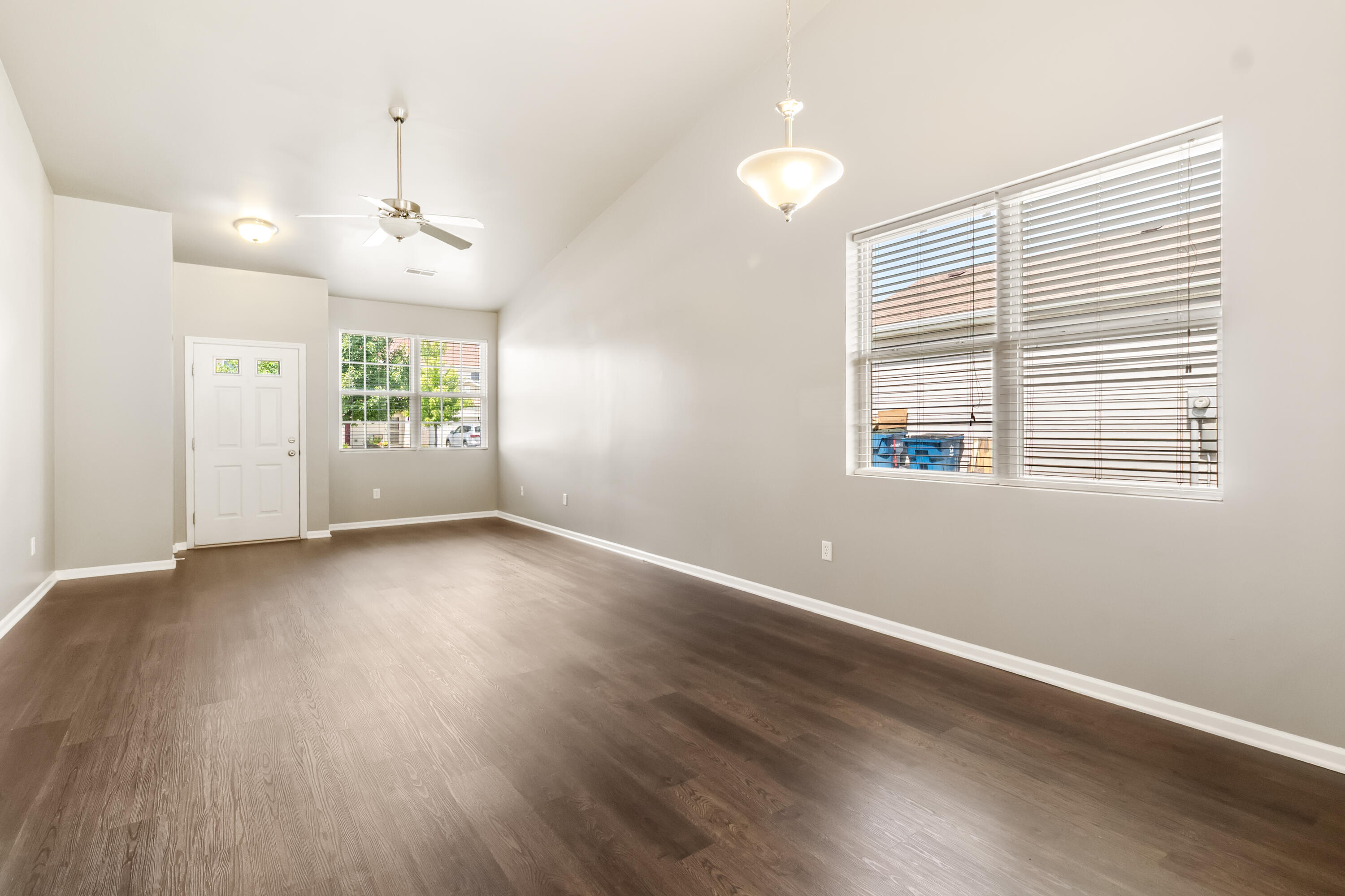 7615 111th Lane Crown Point, IN 46307 - Photo 6 of 19 an empty room with wooden floor and windows