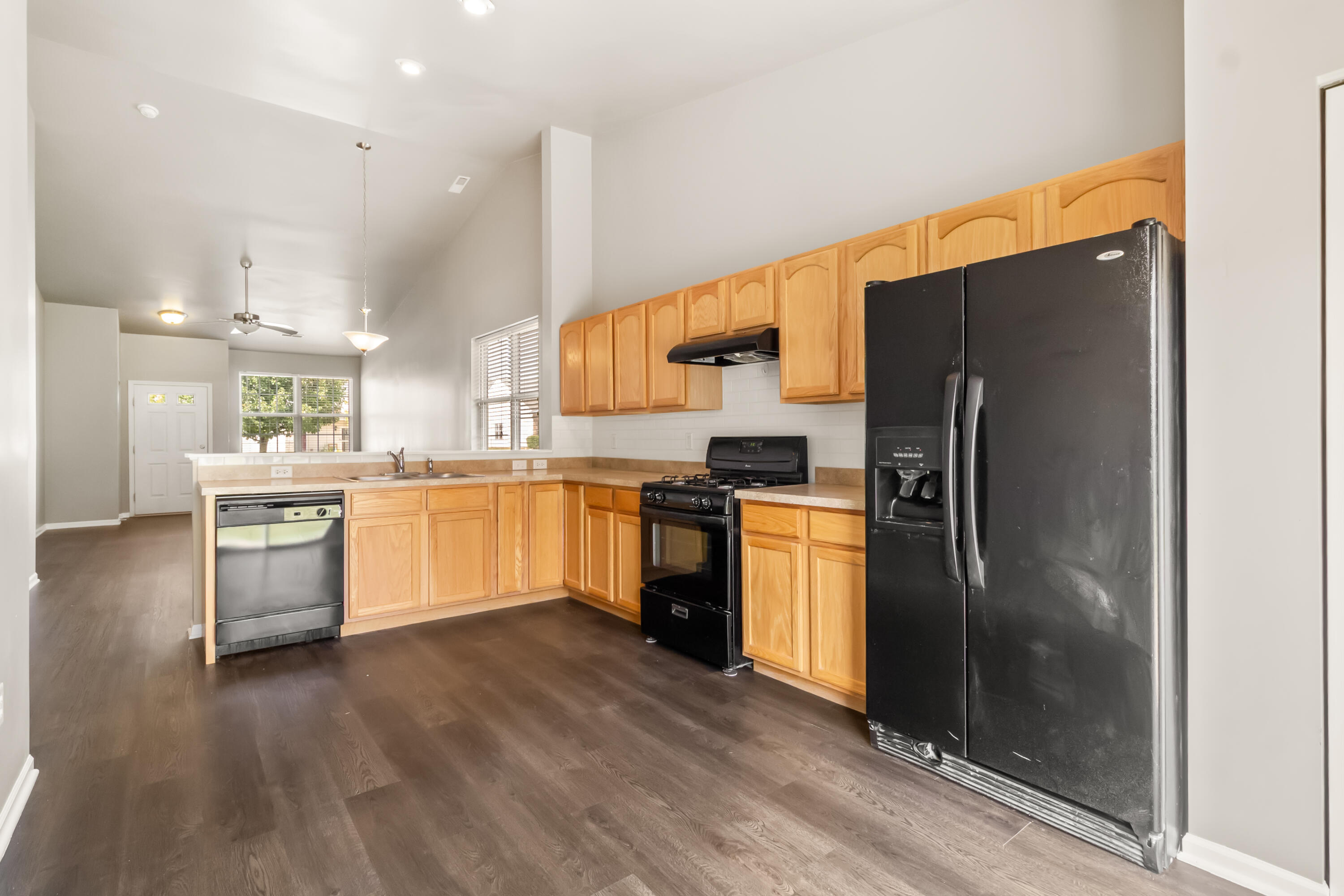 7615 111th Lane Crown Point, IN 46307 - Photo 7 of 19 a kitchen with a refrigerator and a sink