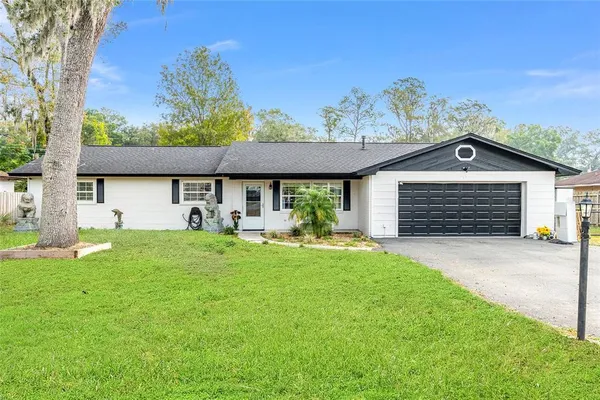 front view of a house with a yard
